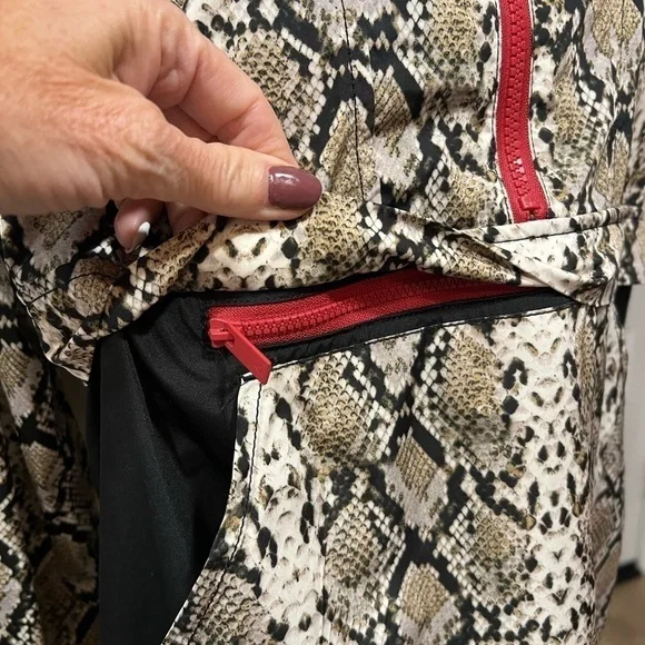 ALALA snakeskin anorak with red accents